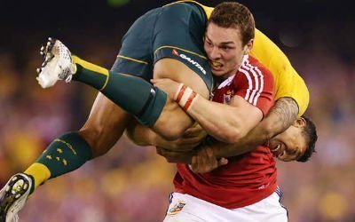 George North in action for the Lions, carrying Israel Folau as he rides a tackle